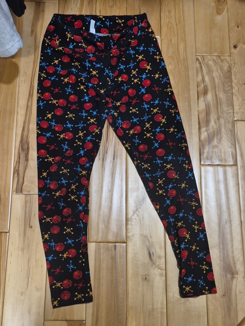LuLaRoe Black Leggings with Red, Blue & Gold Ball and Jacks Print